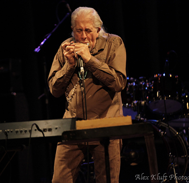Mayall blows harp by A. Kluft